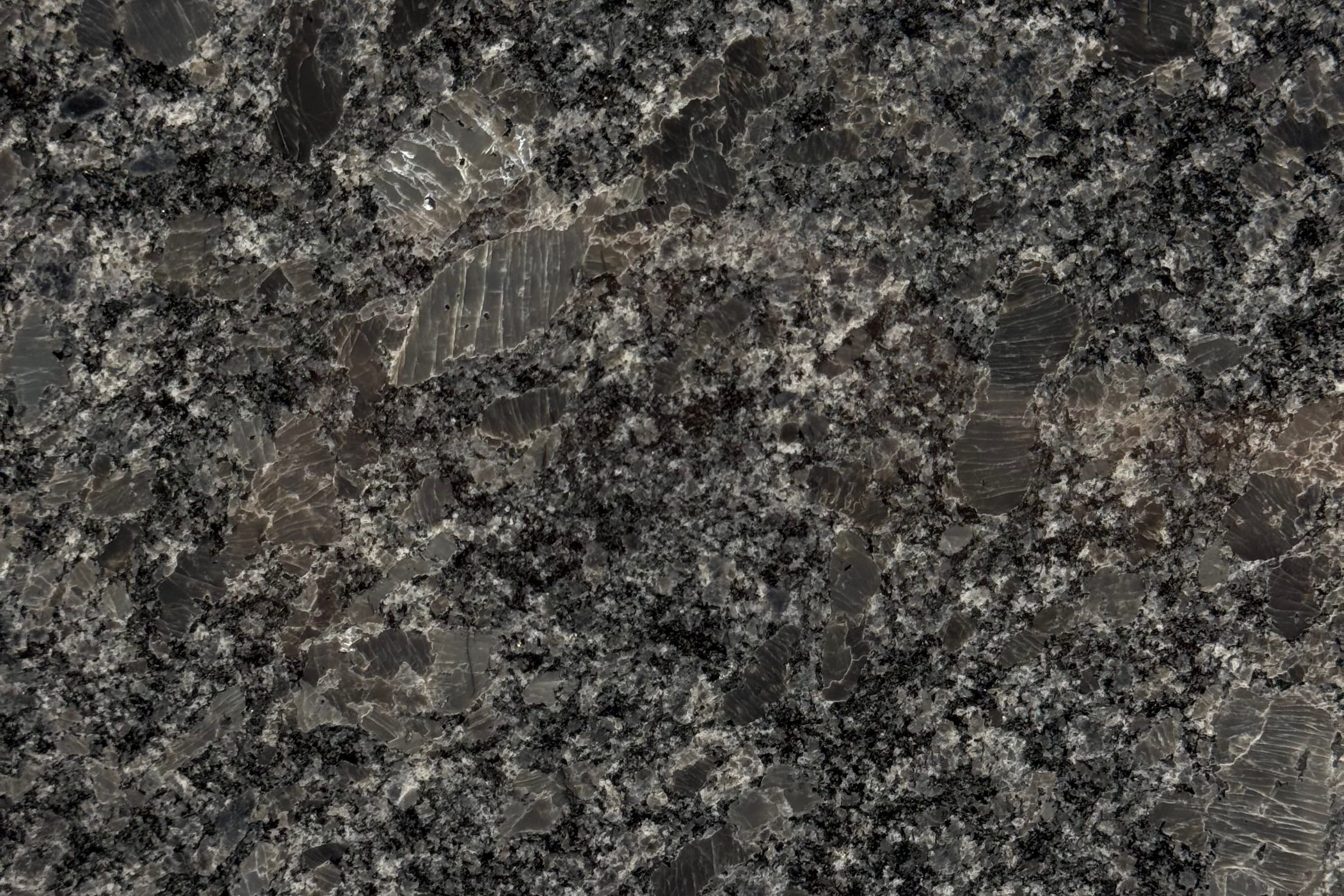 Charcoal granite with coarse black and white grains and large dark crystals
