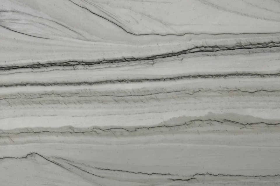 Pale gray stone with thin dark horizontal lines and layered bands, matte surface